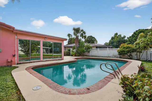 a view of outdoor space yard swimming pool and outdoor seating