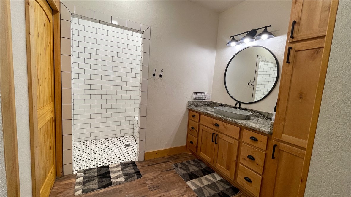 13541 East Us Highway Gause, TX 77857 - Photo 16 of 39 a bathroom with a sink a mirror and a shower