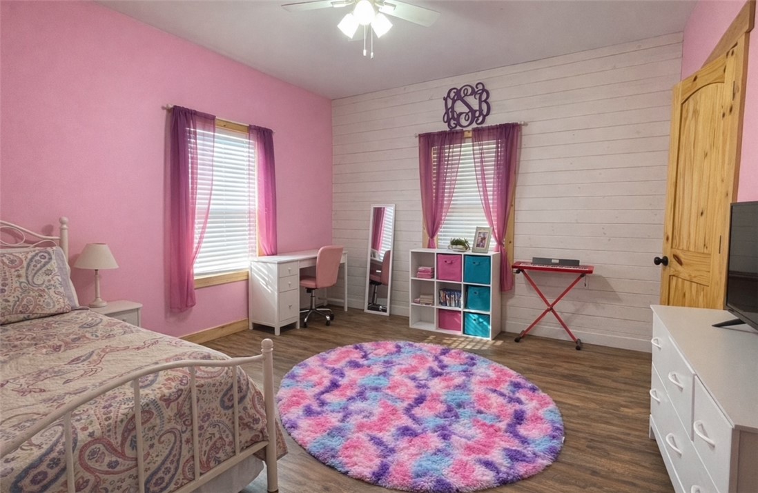 13541 East Us Highway Gause, TX 77857 - Photo 19 of 39 a bedroom with a bed and a chandelier