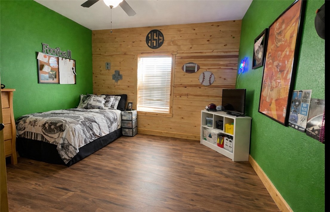 13541 East Us Highway Gause, TX 77857 - Photo 21 of 39 a bedroom with a bed and a flat screen tv
