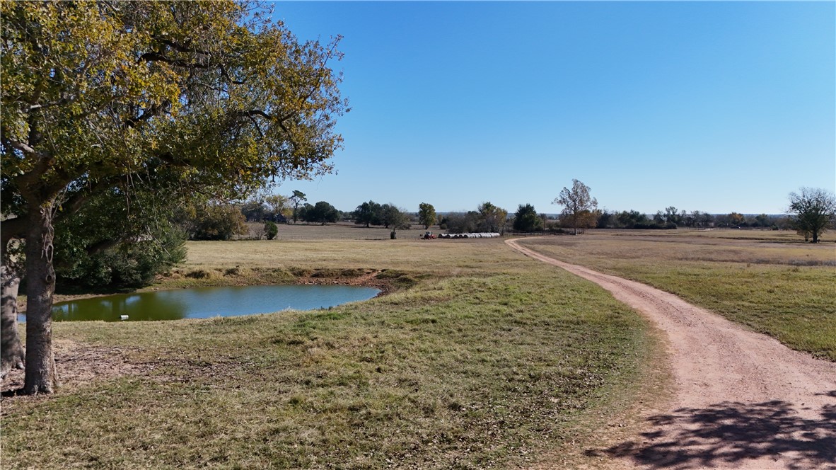13541 East Us Highway Gause, TX 77857 - Photo 36 of 39 a view of a lake with trees and houses in the back