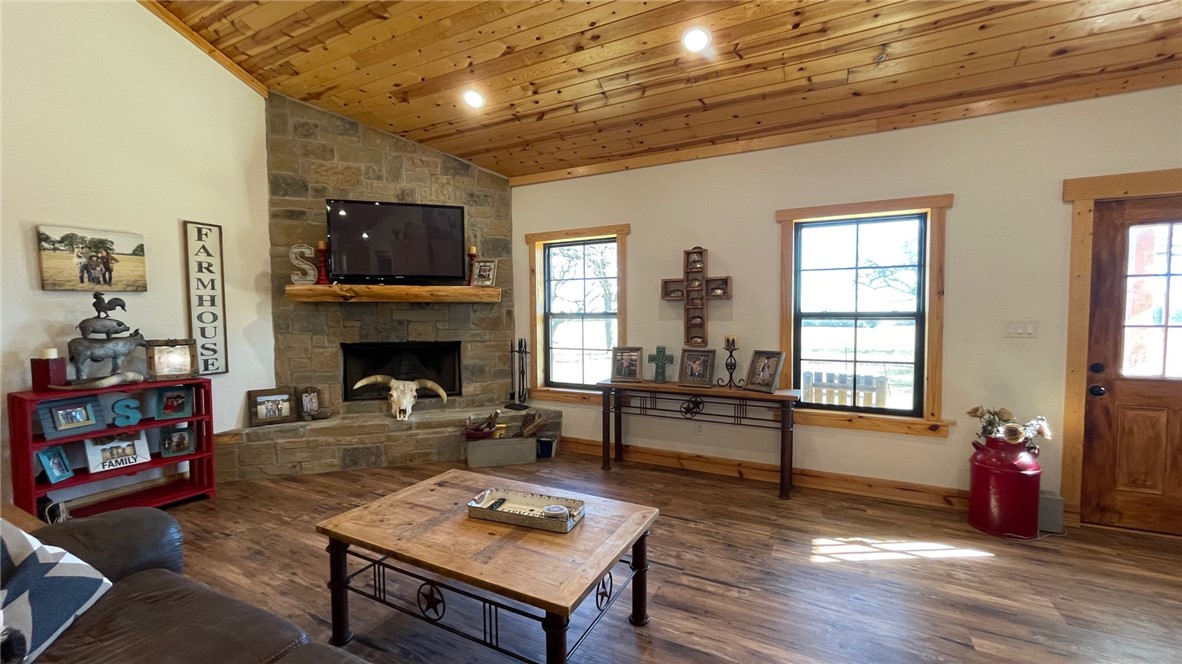 13541 East Us Highway Gause, TX 77857 - Photo 6 of 39 a living room with furniture a flat screen tv and a fireplace