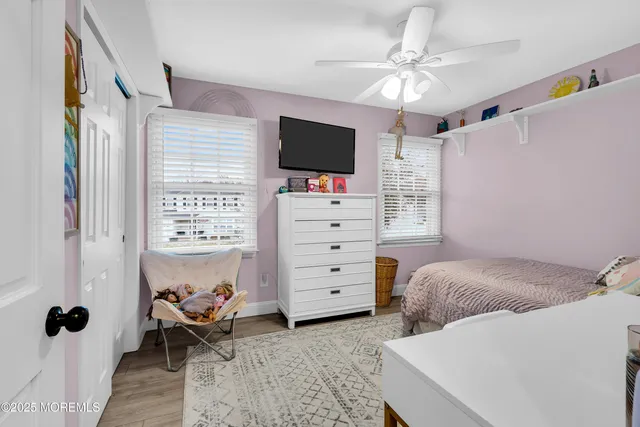 a view of a livingroom with furniture and a flat screen tv