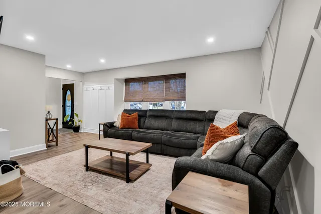 a living room with furniture and a rug