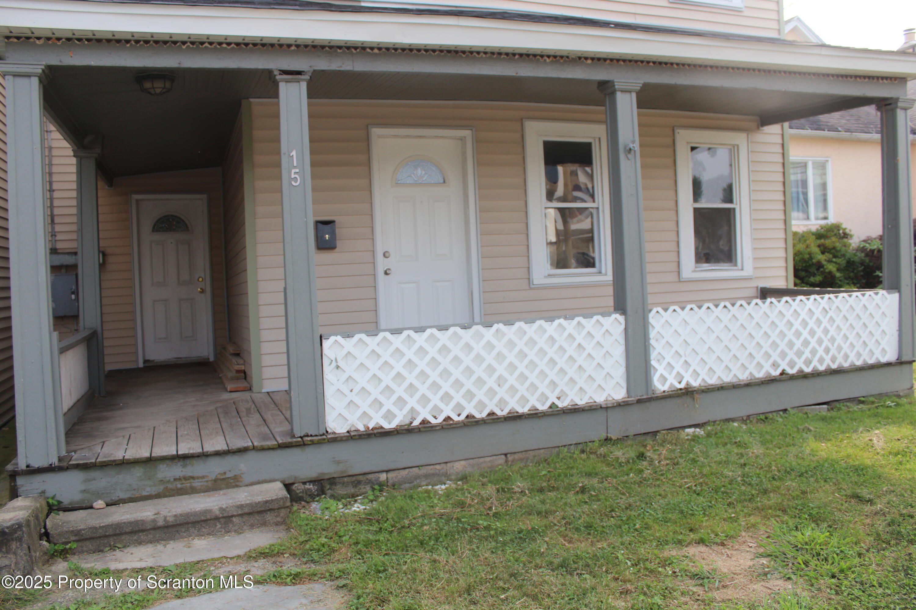 1507 Luzerne Street Scranton, PA 18504 - Photo 3 of 26 front view of a house with a yard