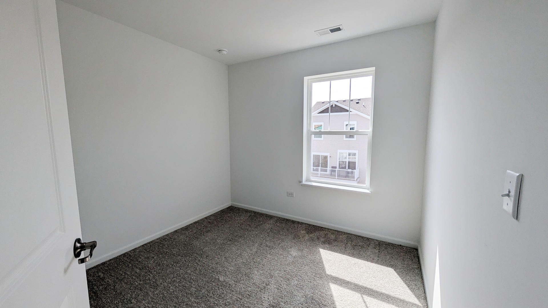 527 Red Oak Circle, Unit 2202 Volo, IL 60020 - Photo 13 of 17 a view of an empty room with a window