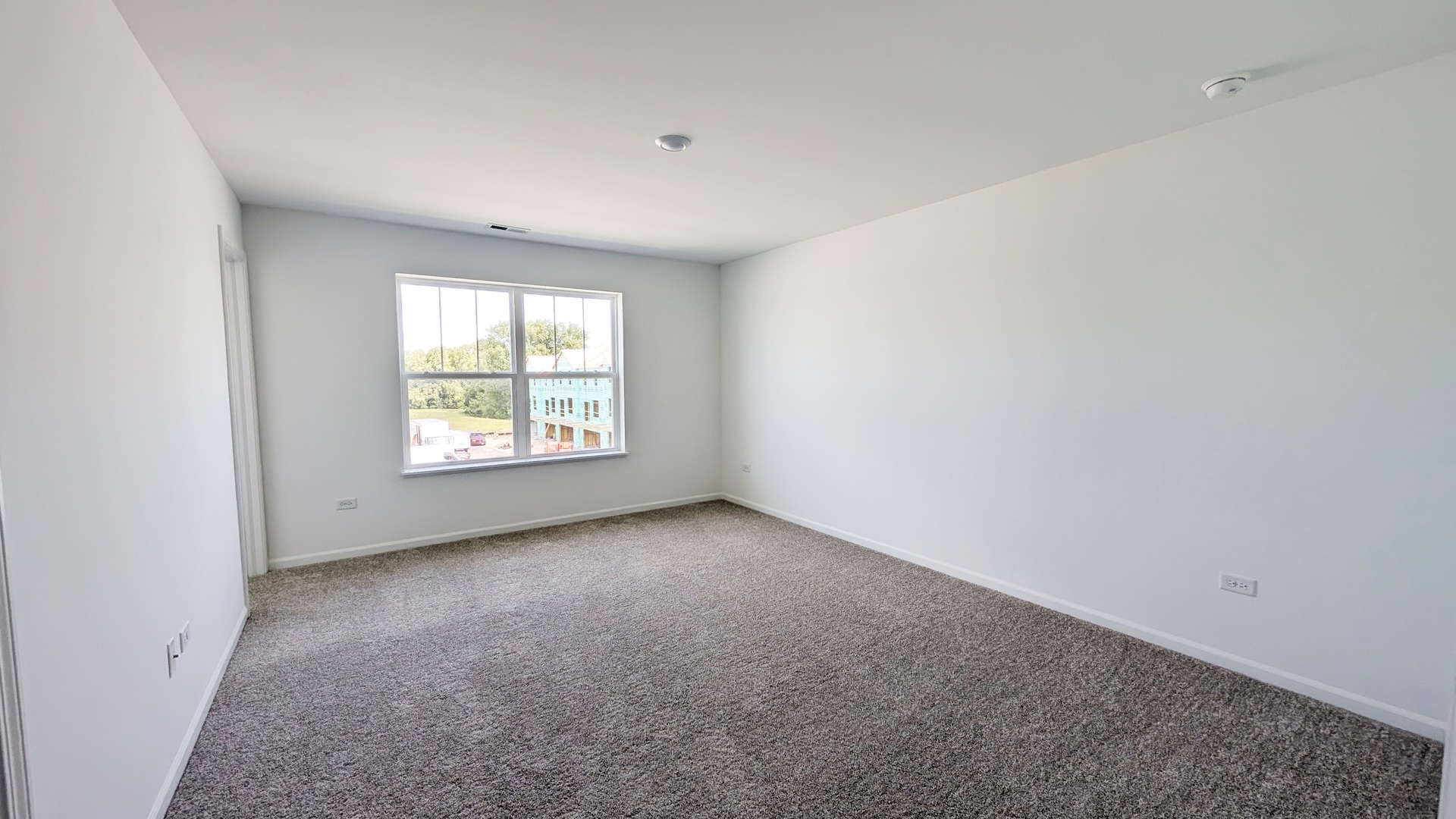 527 Red Oak Circle, Unit 2202 Volo, IL 60020 - Photo 7 of 17 an empty room with windows