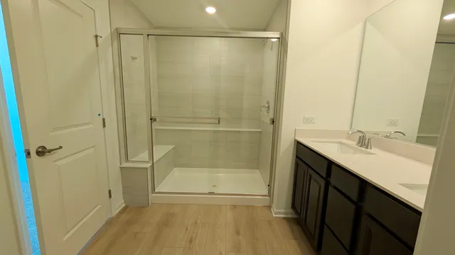 a bathroom with a shower and a sink