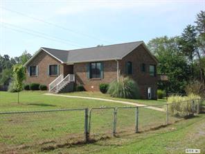 104 Huffstetler Lake Road Dallas, NC 28034 - Photo 1 of 16 a front view of a house with a yard