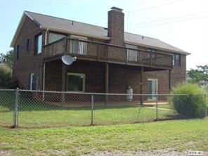 104 Huffstetler Lake Road Dallas, NC 28034 - Photo 2 of 16 a house that has a backyard