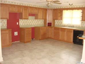 104 Huffstetler Lake Road Dallas, NC 28034 - Photo 4 of 16 a view of a kitchen with a sink cabinets and a window