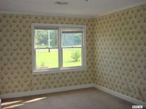 104 Huffstetler Lake Road Dallas, NC 28034 - Photo 6 of 16 an empty room with a window