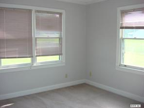 104 Huffstetler Lake Road Dallas, NC 28034 - Photo 8 of 16 an empty room with a window
