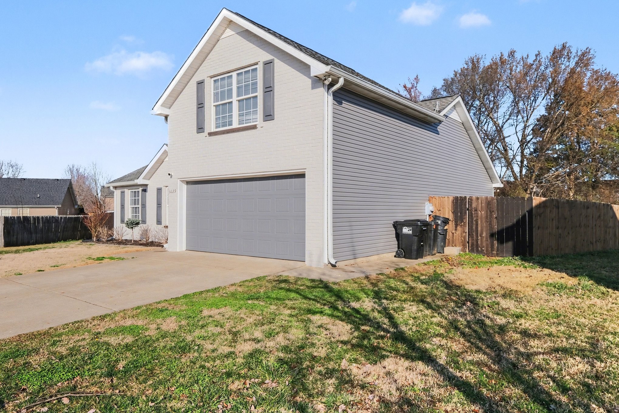 3229 Lexmark Circle Murfreesboro, TN 37128 - Photo 3 of 31 a front view of a house with a yard and garage