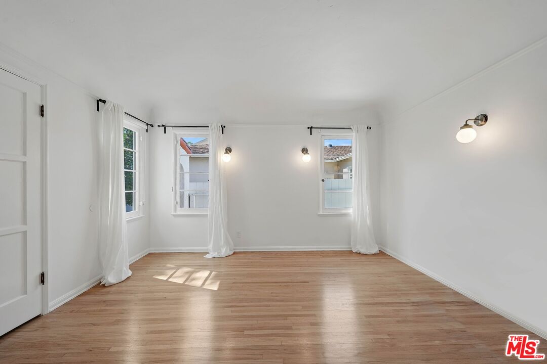 355 21st Place Santa Monica, CA 90402 - Photo 12 of 16 a view of empty room with wooden floor and fan
