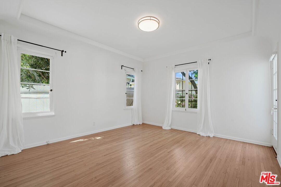 355 21st Place Santa Monica, CA 90402 - Photo 13 of 16 a view of empty room with wooden floor and fan