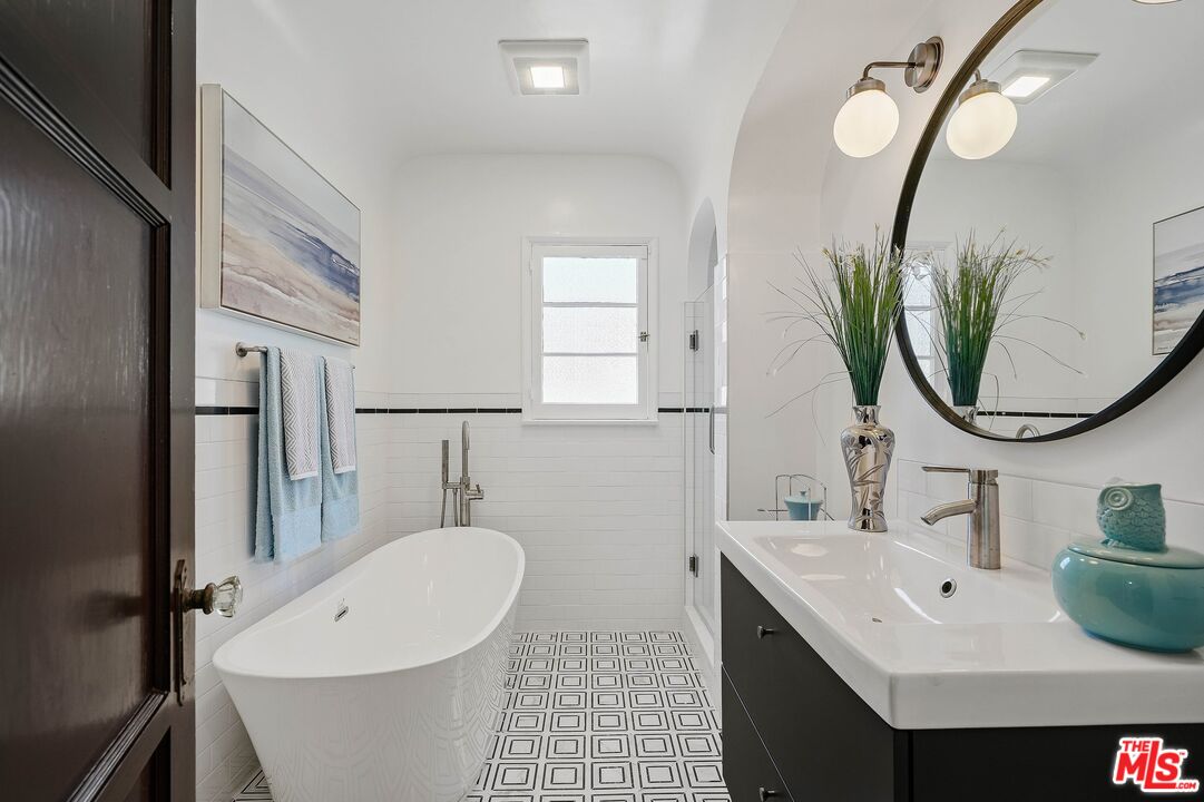 355 21st Place Santa Monica, CA 90402 - Photo 14 of 16 a bathroom with a sink and a mirror