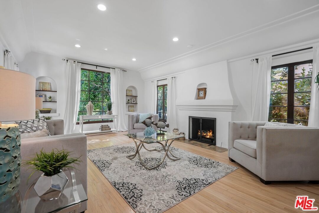 355 21st Place Santa Monica, CA 90402 - Photo 3 of 16 a living room with furniture fireplace and window