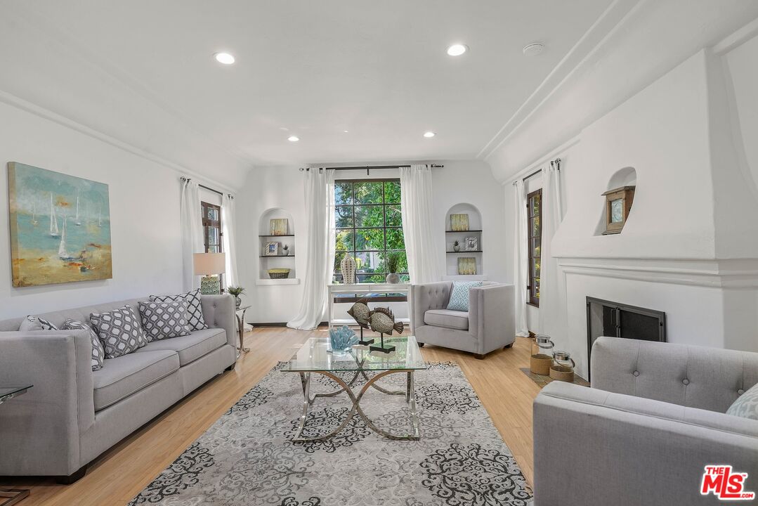 355 21st Place Santa Monica, CA 90402 - Photo 4 of 16 a living room with furniture and a fireplace