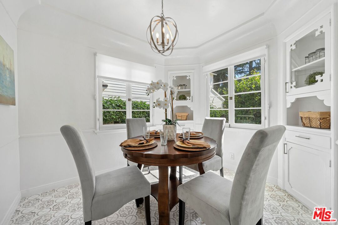 355 21st Place Santa Monica, CA 90402 - Photo 8 of 16 a dining room with furniture a chandelier and wooden floor