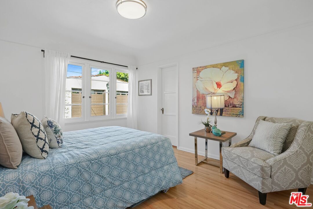 355 21st Place Santa Monica, CA 90402 - Photo 10 of 16 a bedroom with a bed and window