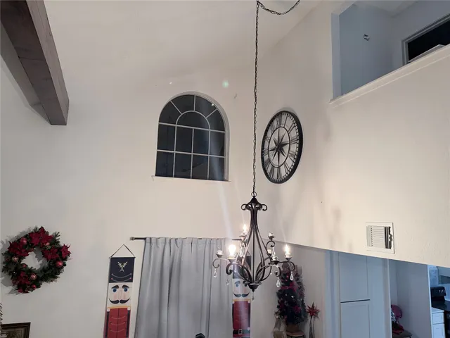 a view of a hallway with paintings on the wall