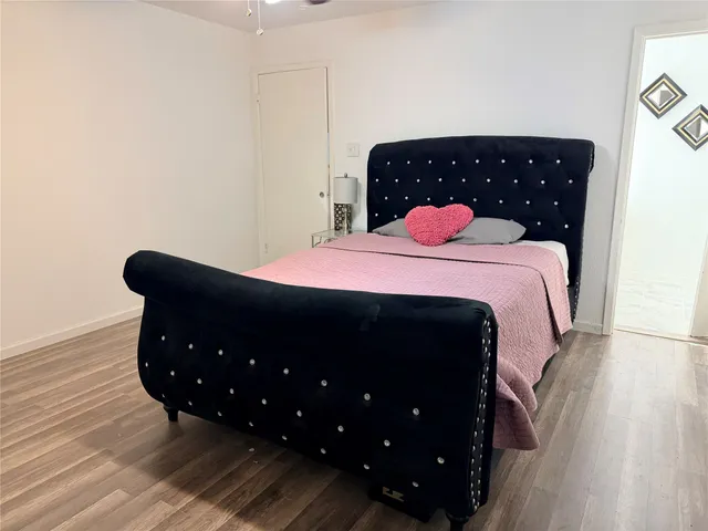 a bedroom with a bed and a dresser