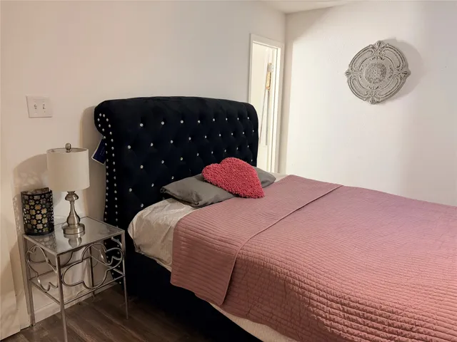 a bedroom with a bed and cabinets