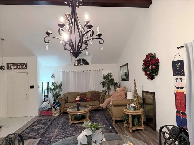 a living room with furniture and flowers