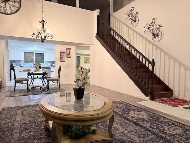 a view of a livingroom with furniture and entryway