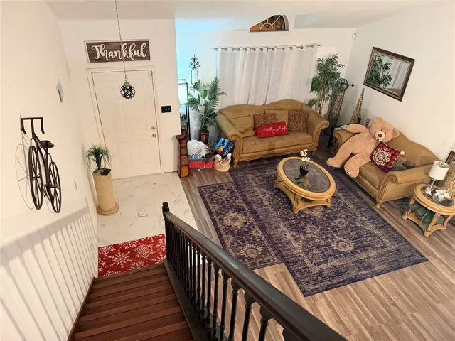 a living room with furniture and a rug