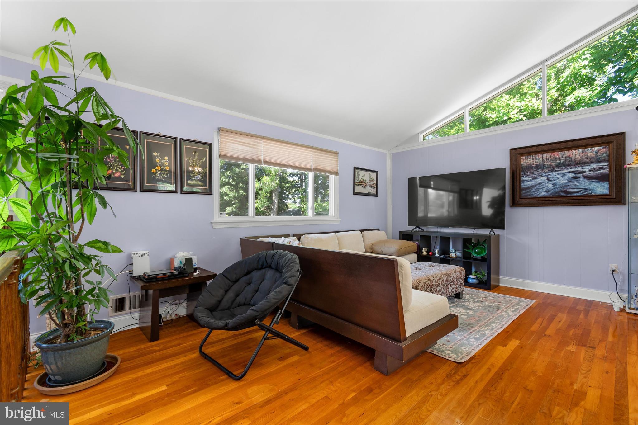 8304 Harland Drive Springfield, VA 22152 - Photo 5 of 39 a living room with furniture and a flat screen tv