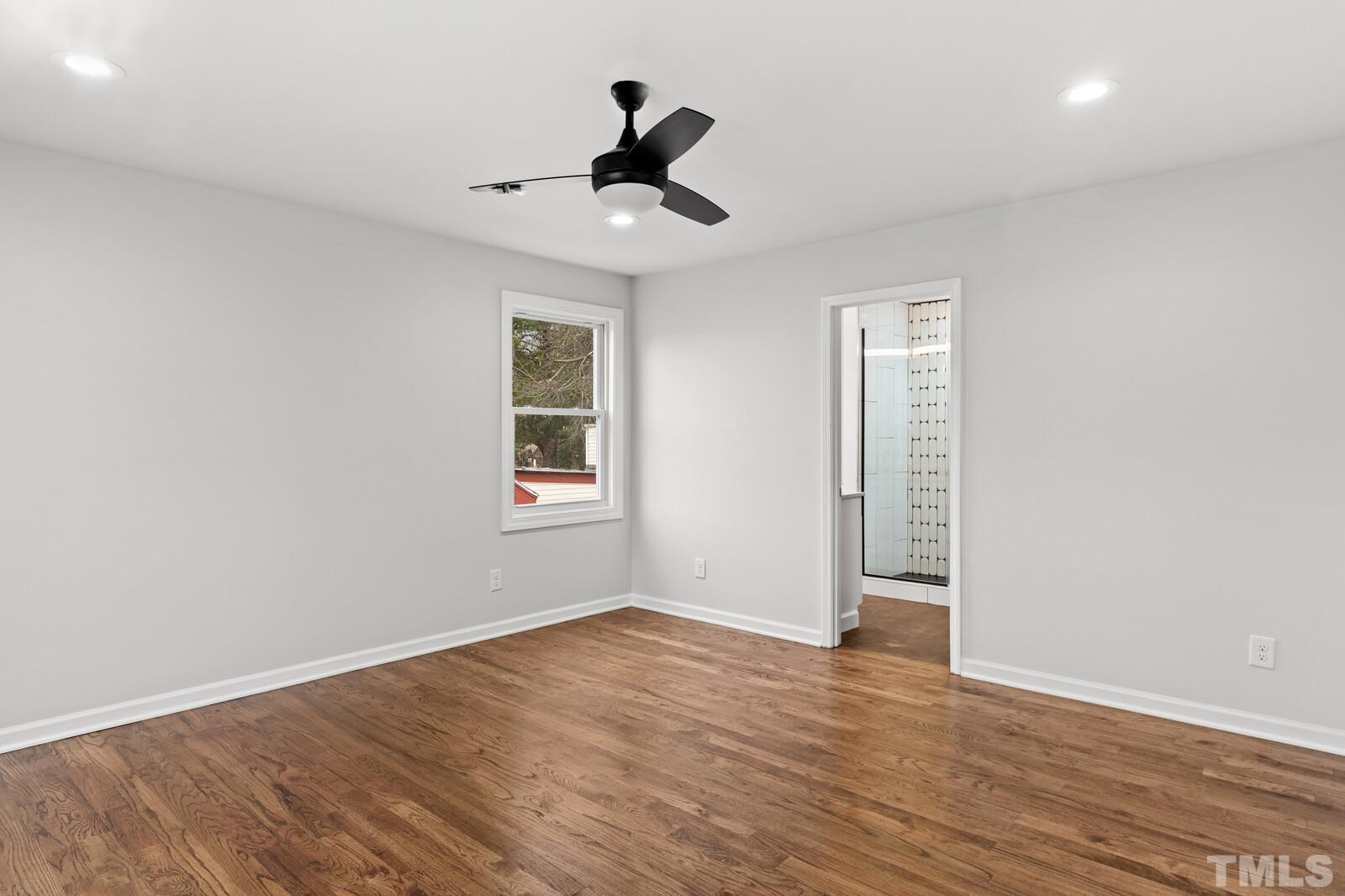 1808 Poole Road Raleigh, NC 27610 - Photo 20 of 35 wooden floor in an empty room with a window