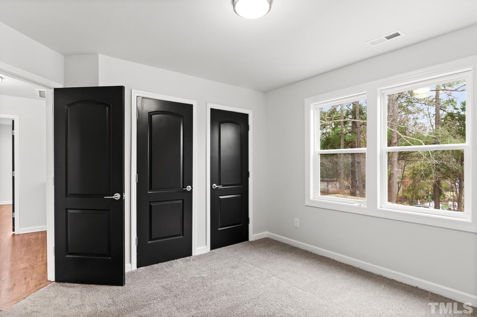 1808 Poole Road Raleigh, NC 27610 - Photo 29 of 35 an empty room with windows and closet