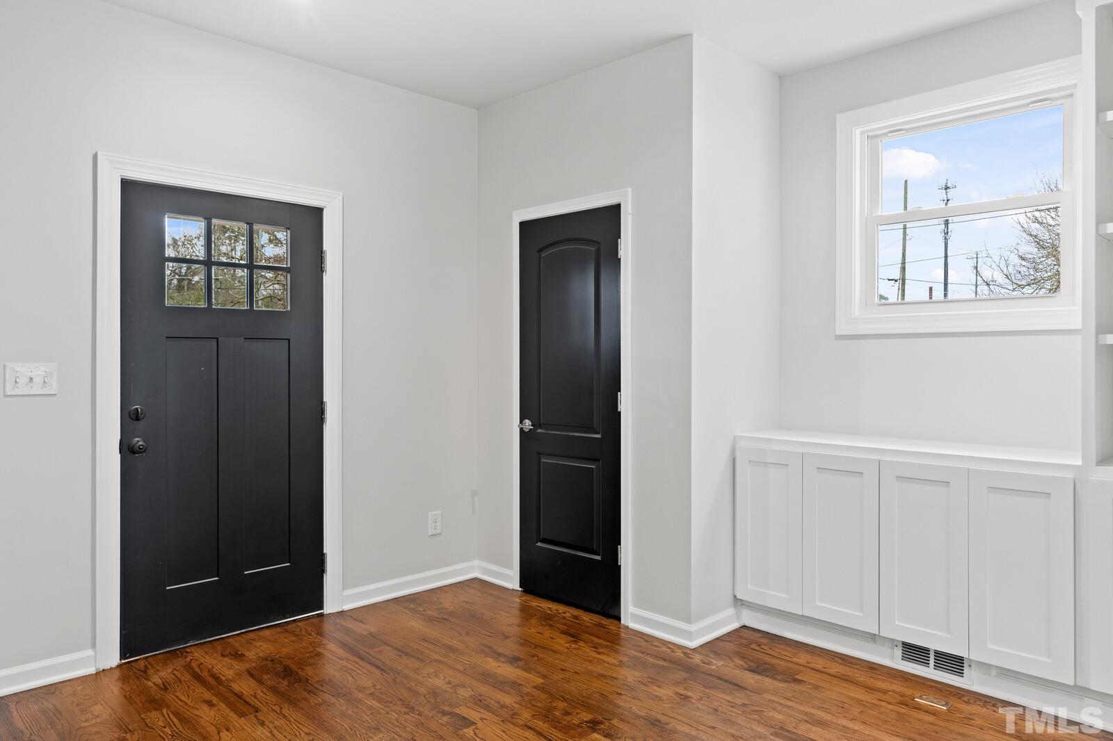 1808 Poole Road Raleigh, NC 27610 - Photo 6 of 35 an empty room with closet and wooden floor