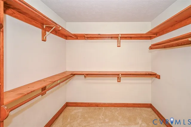 a spacious bathroom with a tub sink and mirror