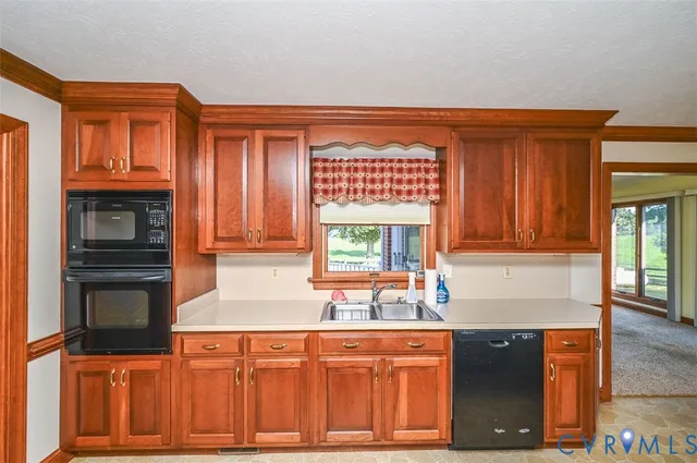 a kitchen with stainless steel appliances granite countertop a stove and a sink