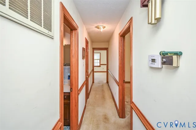 a view of a room with a ceiling fan
