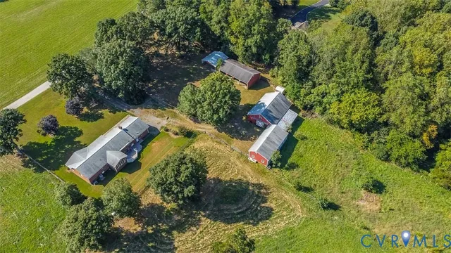 an aerial view of a house with swimming pool