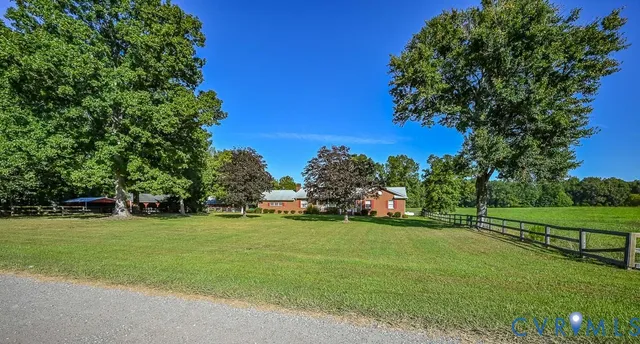 a view of a swimming pool with a yard