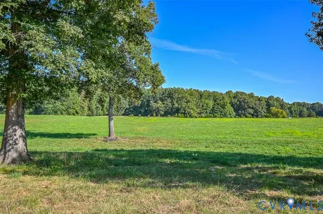a view of wooden deck with a lake view