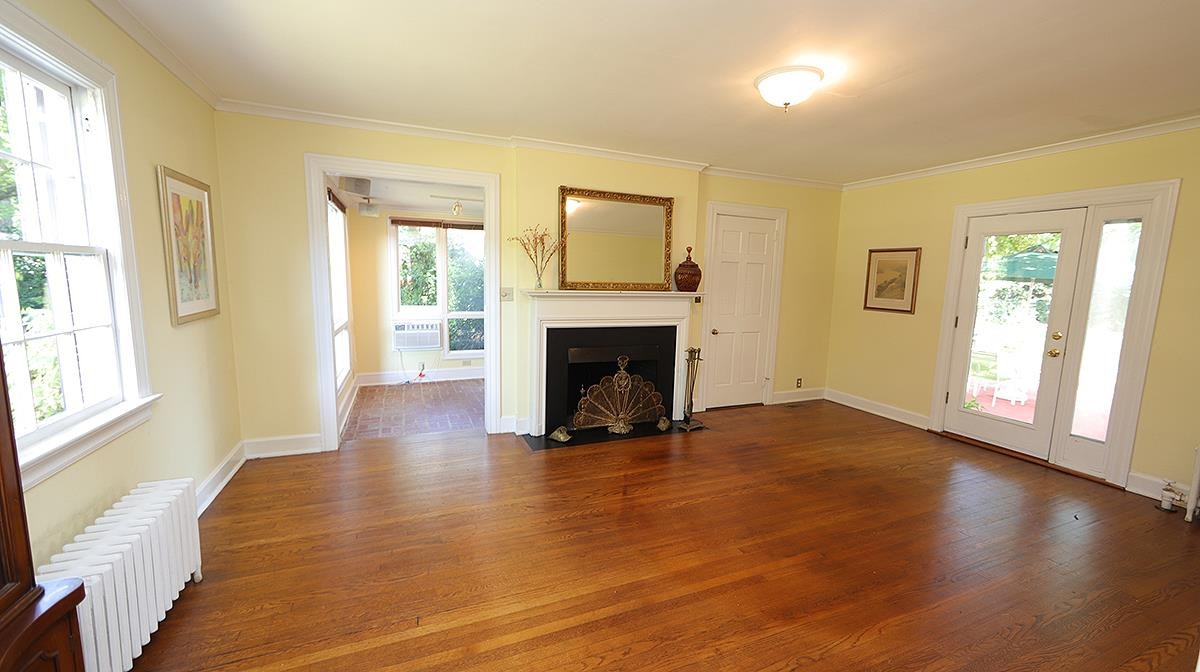 1608 Craig Street Raleigh, NC 27608 - Photo 6 of 42 The perfect place to gather with a fireplace for the winter and easy step out on the patio this Fall. Living Room