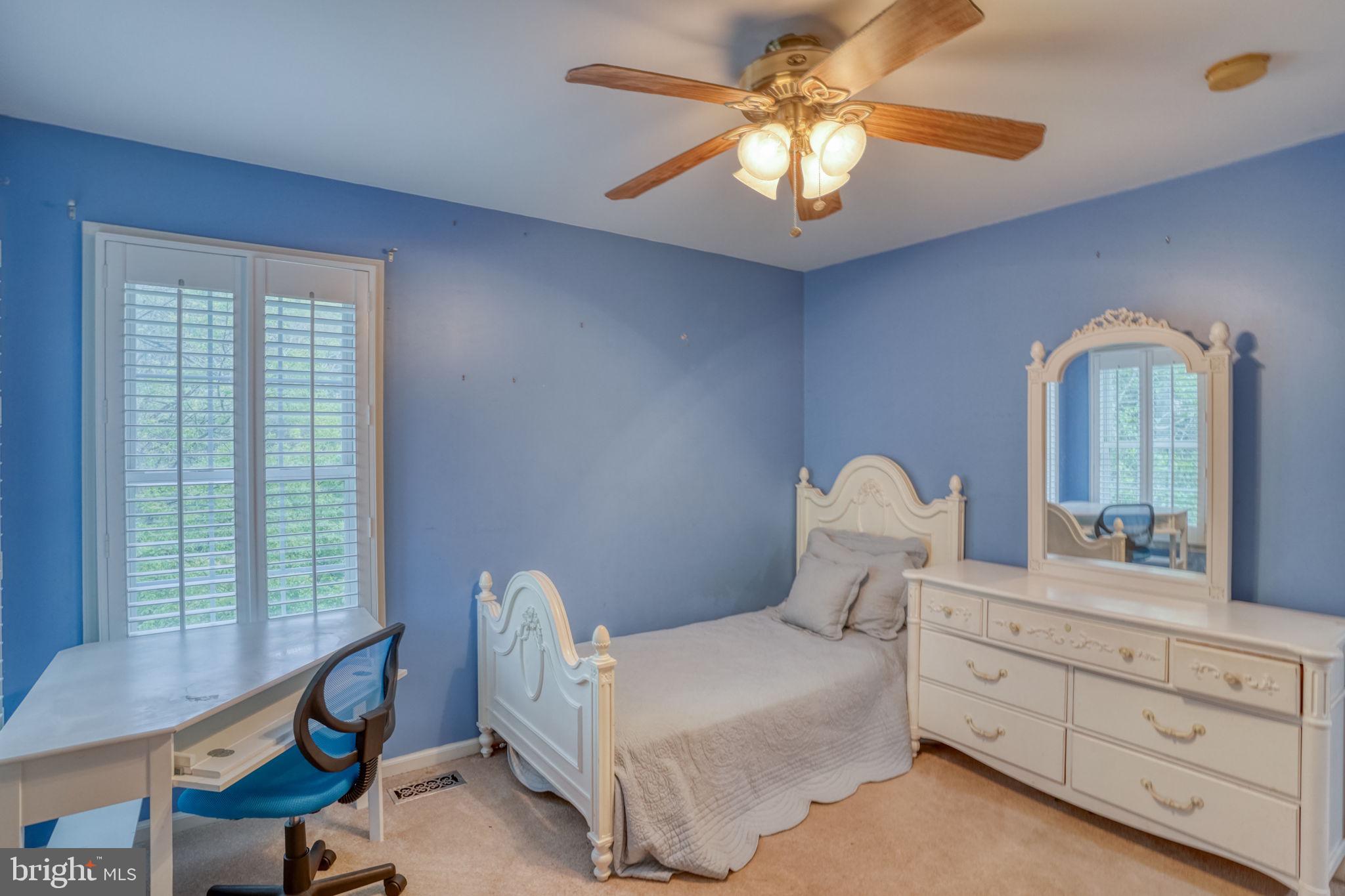 357 Willits Way Garnet Valley, PA 19060 - Photo 42 of 63 a bedroom with a bed and a chandelier