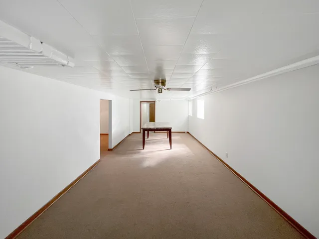 a view of a livingroom with stairs