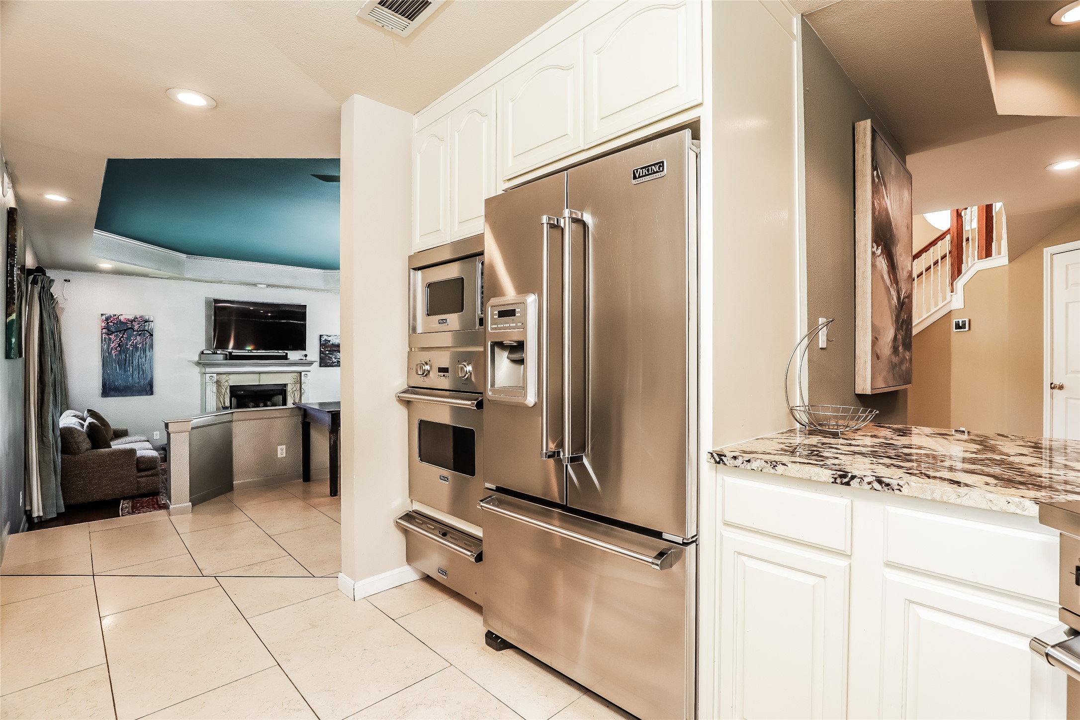 1702 Newning Avenue, Unit A Austin, TX 78704 - Photo 6 of 20 Gourmet kitchen featuring stainless steel appliances including a built-in oven and microwave, alongside a side-by-side refrigerator