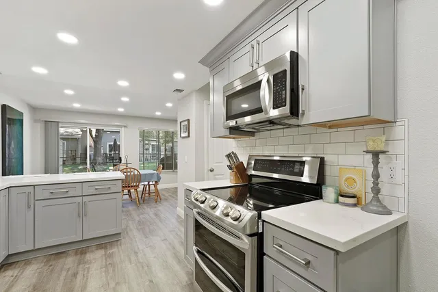 a kitchen with a stove and a microwave