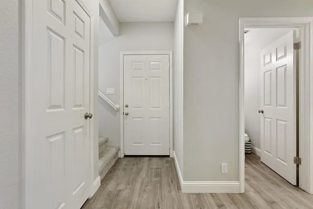 an empty room with wooden floor