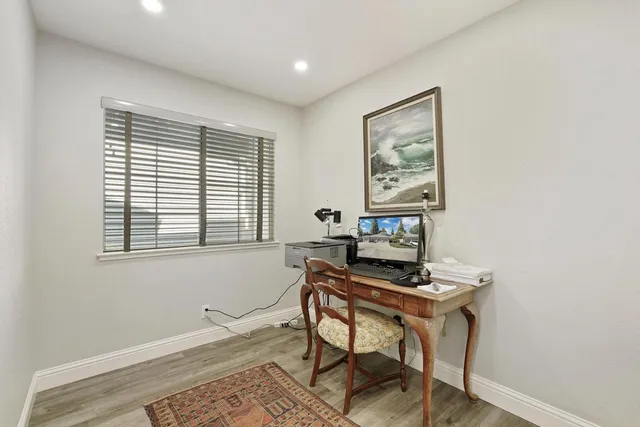 a workspace with furniture and a window