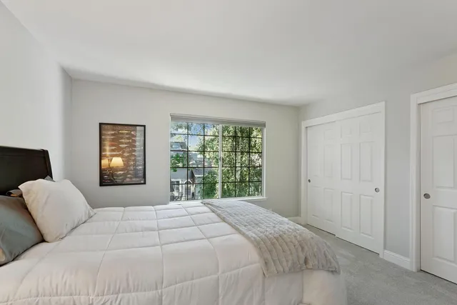 a bathroom with 2 sink and a mirror