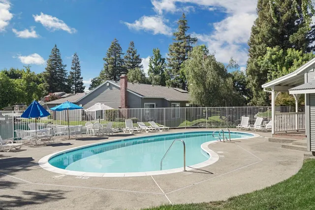 a front view of house with a garden